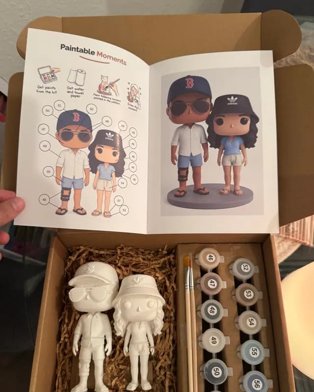 Kit with a couple in baseball caps shown in the guide and as unpainted figurines